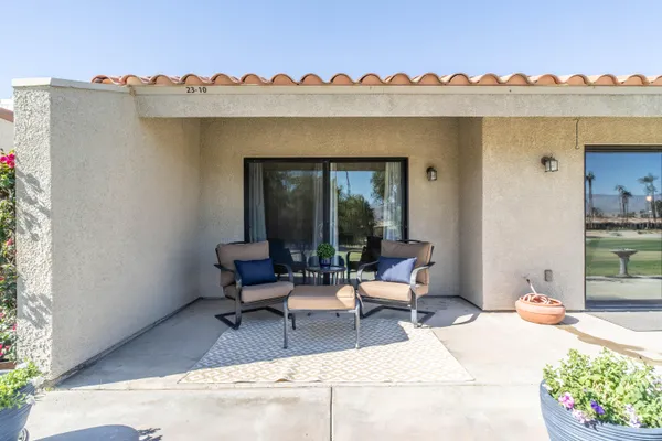 a view of a patio with swimming pool