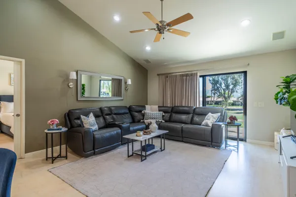 a living room with furniture and a large window