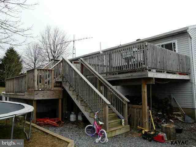 983 Richmond Road Windsor, PA 17366 - Photo 2 of 36 a view of backyard with deck and wooden stairs