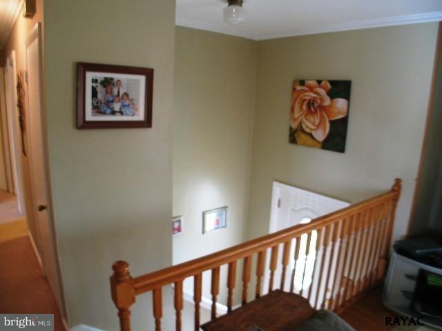 983 Richmond Road Windsor, PA 17366 - Photo 11 of 36 a view of a hallway with wooden floor and a bathroom