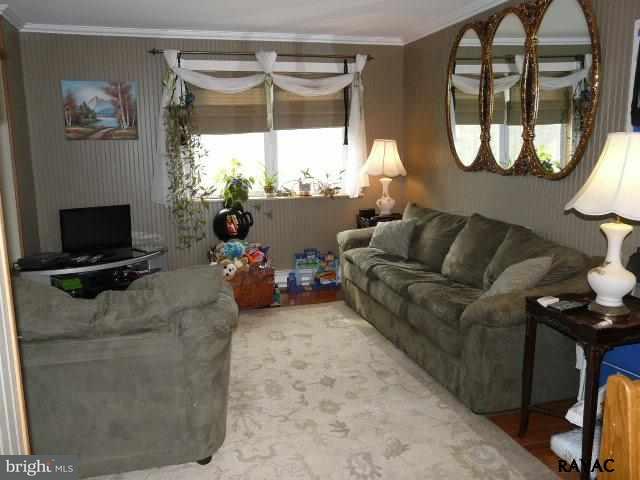 983 Richmond Road Windsor, PA 17366 - Photo 13 of 36 a living room with furniture and a large window