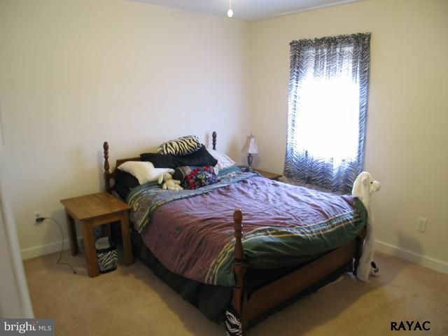 983 Richmond Road Windsor, PA 17366 - Photo 22 of 36 a bedroom with a bed and a window