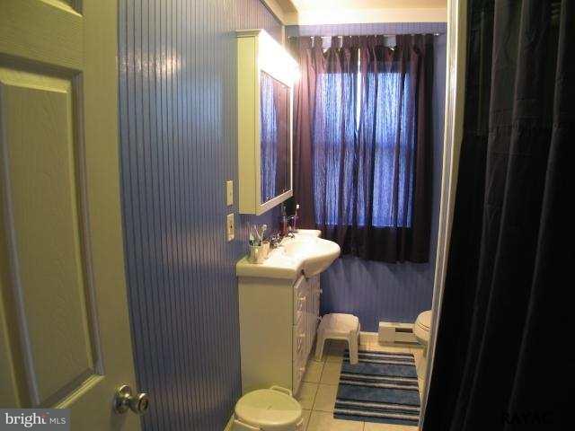 983 Richmond Road Windsor, PA 17366 - Photo 24 of 36 a bathroom with a sink toilet and mirror