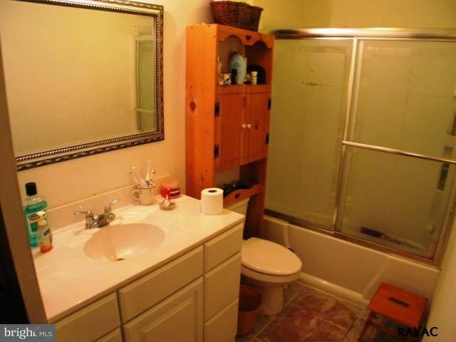983 Richmond Road Windsor, PA 17366 - Photo 30 of 36 a bathroom with a sink mirror vanity and toilet
