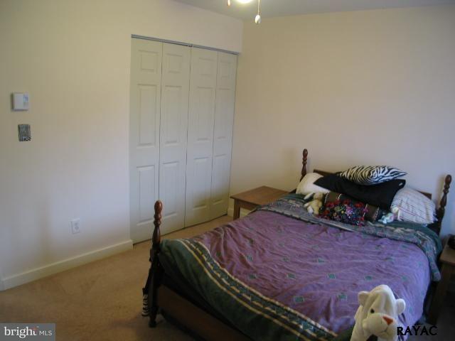 983 Richmond Road Windsor, PA 17366 - Photo 32 of 36 a bed sitting in a bedroom next to a window