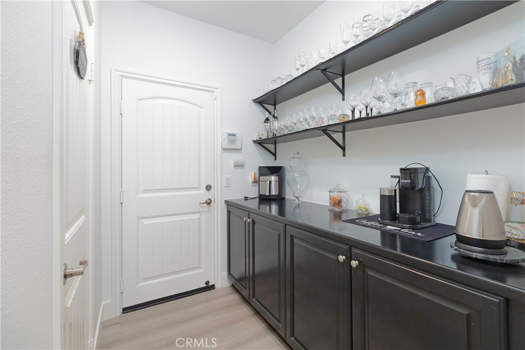 13866 Sweet Avenue Riverside, CA 92503 - Photo 13 of 69 a kitchen with stainless steel appliances a sink and cabinets