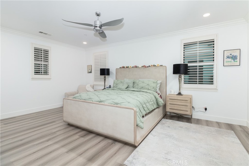 13866 Sweet Avenue Riverside, CA 92503 - Photo 16 of 69 a bedroom with a large bed and a window