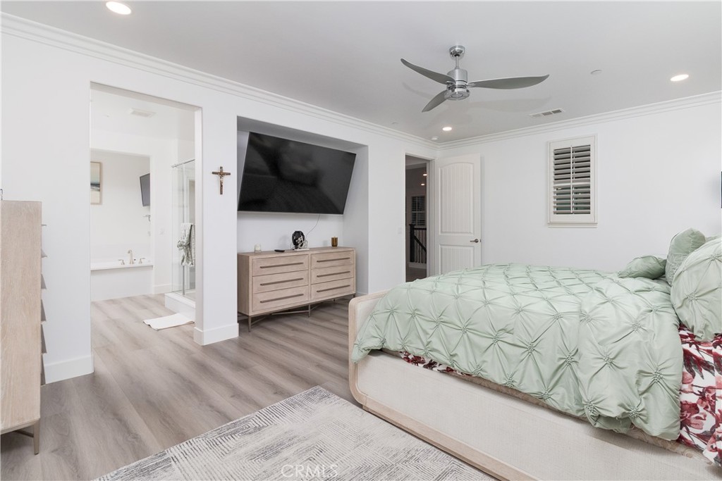 13866 Sweet Avenue Riverside, CA 92503 - Photo 17 of 69 a bedroom with a bed window and a flat screen tv