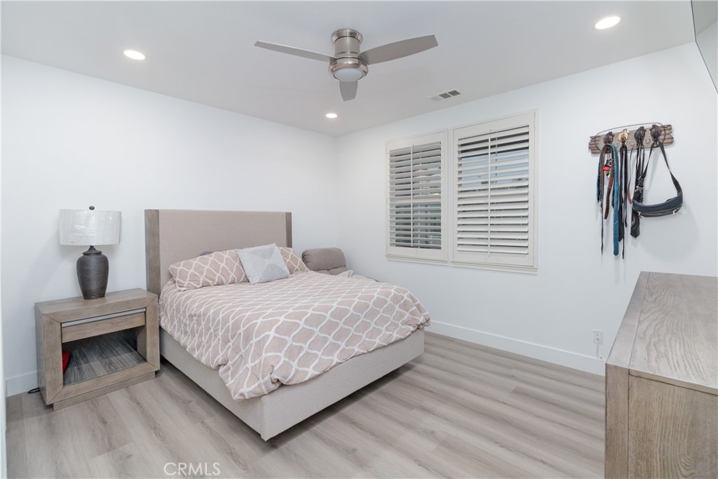 13866 Sweet Avenue Riverside, CA 92503 - Photo 18 of 69 a bedroom with a large bed and a window