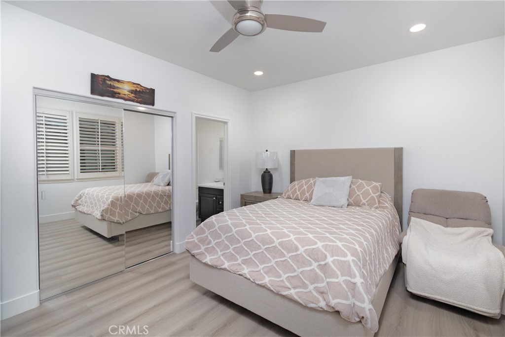 13866 Sweet Avenue Riverside, CA 92503 - Photo 19 of 69 a bedroom with a large bed and a couch