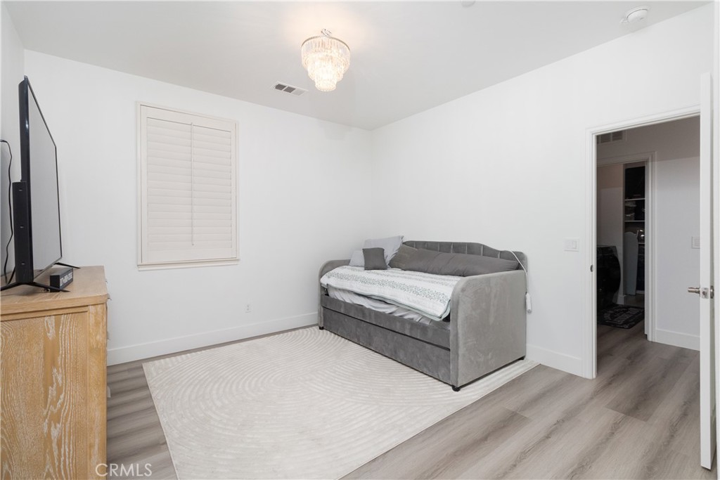 13866 Sweet Avenue Riverside, CA 92503 - Photo 21 of 69 a living room with furniture and a flat screen tv