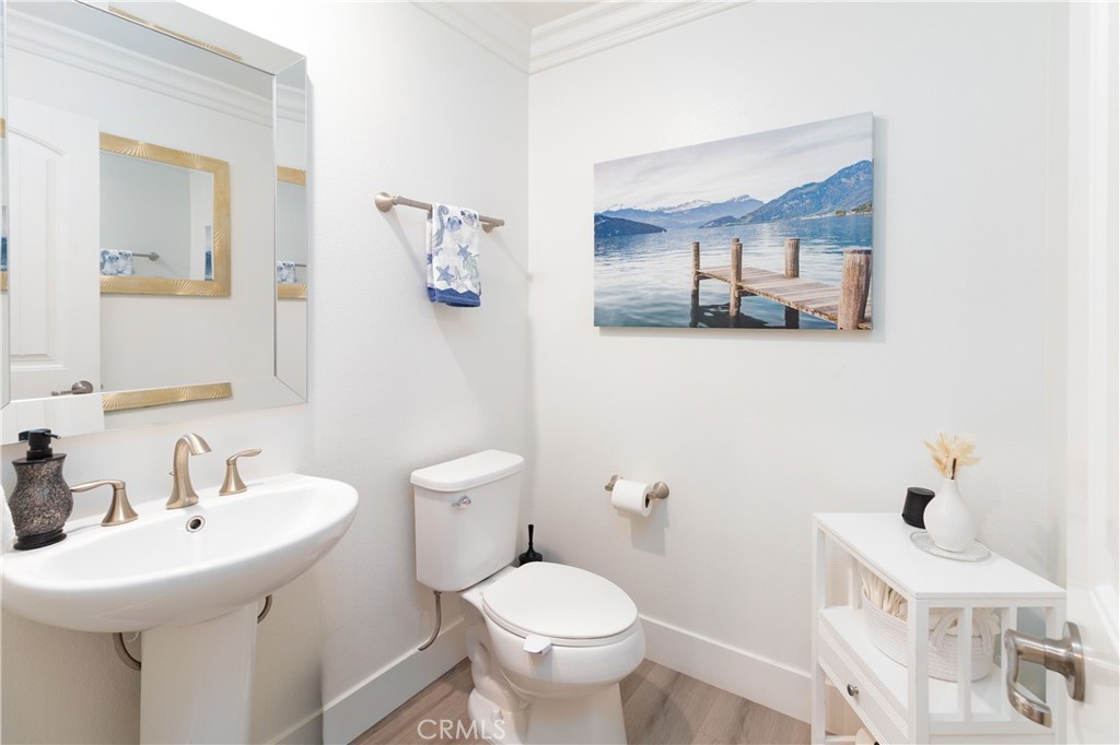 13866 Sweet Avenue Riverside, CA 92503 - Photo 28 of 69 a bathroom with a toilet sink and mirror