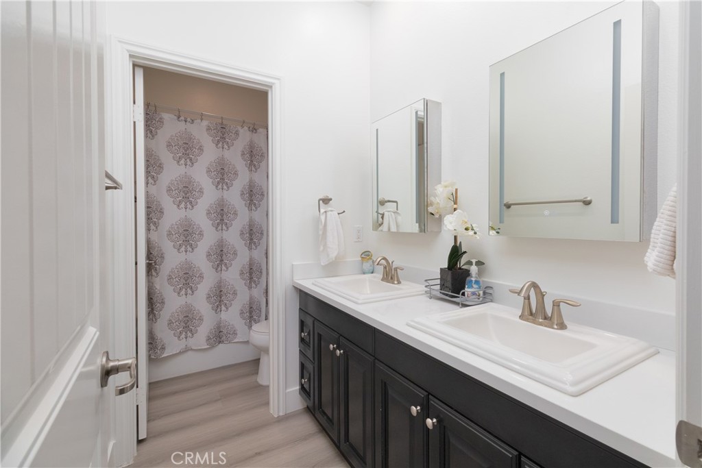 13866 Sweet Avenue Riverside, CA 92503 - Photo 33 of 69 a bathroom with a sink double vanity and a mirror