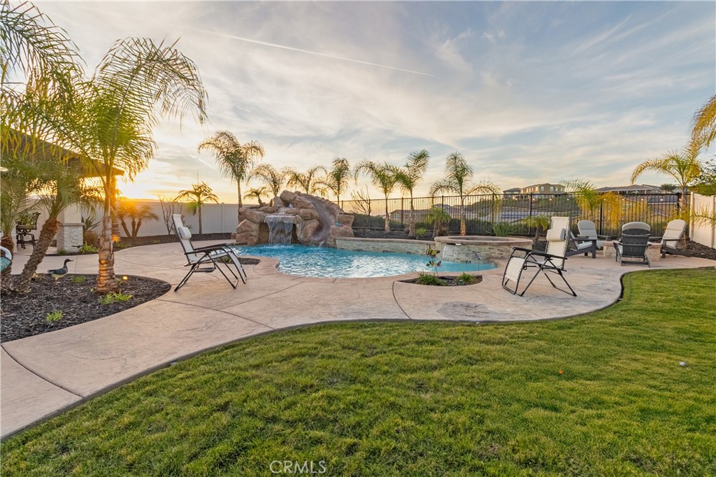 13866 Sweet Avenue Riverside, CA 92503 - Photo 36 of 69 a view of a swimming pool with a table and chairs