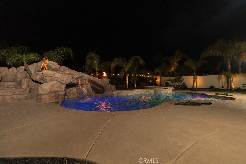 13866 Sweet Avenue Riverside, CA 92503 - Photo 55 of 69 a view of a swimming pool with an outdoor space and seating area