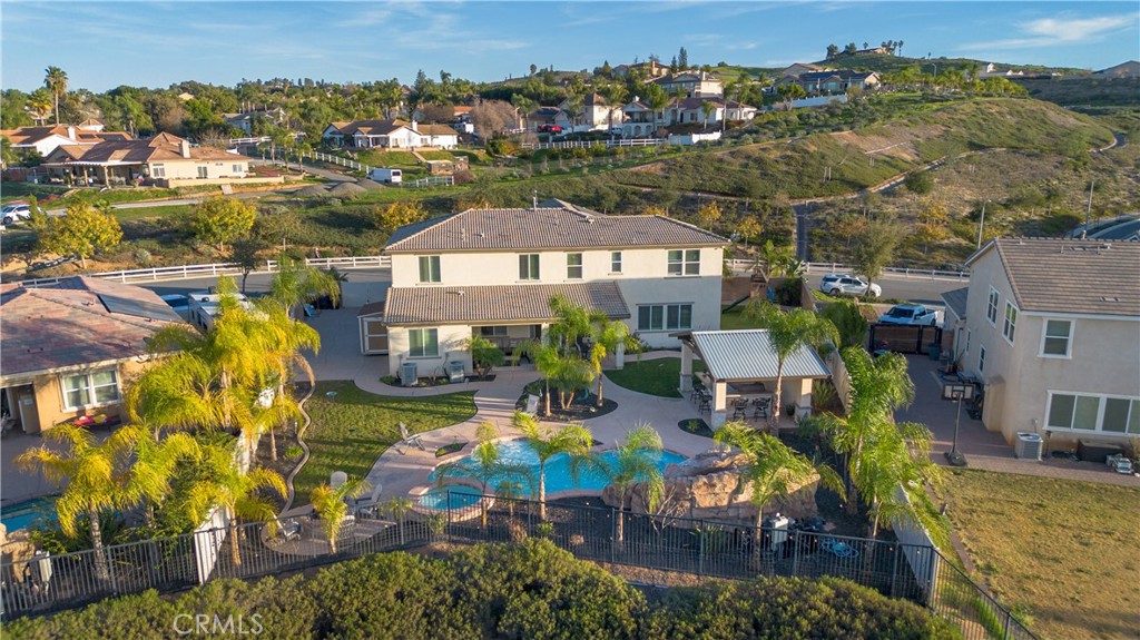 13866 Sweet Avenue Riverside, CA 92503 - Photo 61 of 69 an aerial view of a house with a swimming pool outdoor seating yard and mountain view
