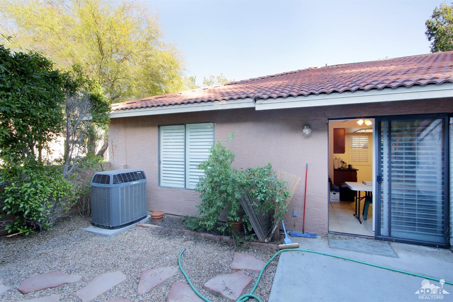 43376 Cook Street, Unit 96 Palm Desert, CA 92211 - Photo 11 of 29 a front view of a house with porch