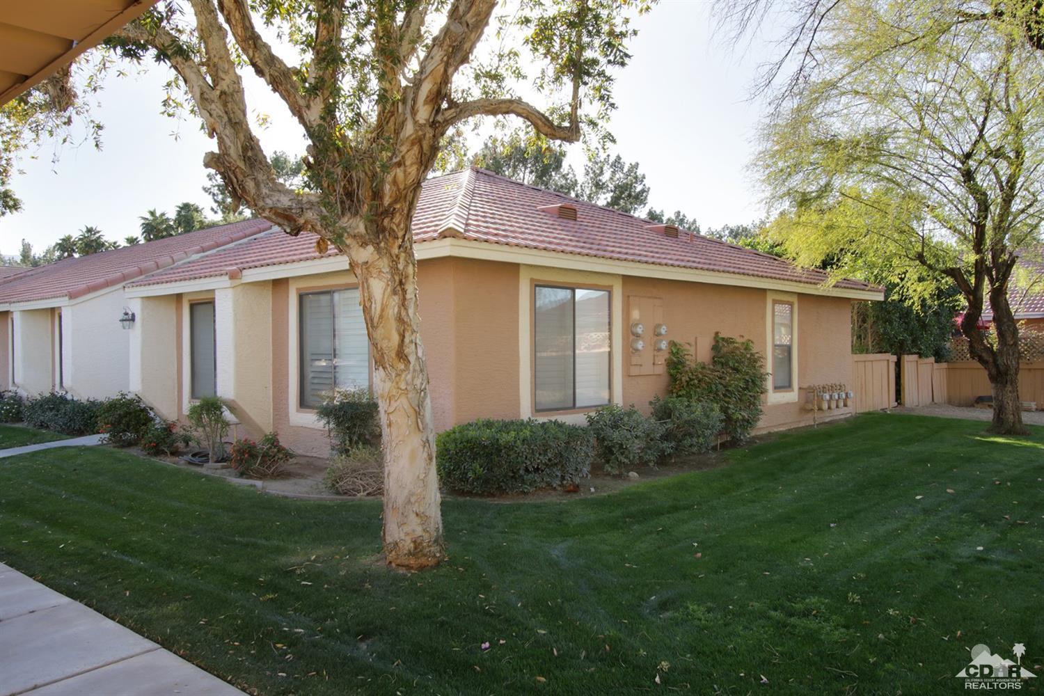 43376 Cook Street, Unit 96 Palm Desert, CA 92211 - Photo 13 of 29 a view of a house with backyard and garden