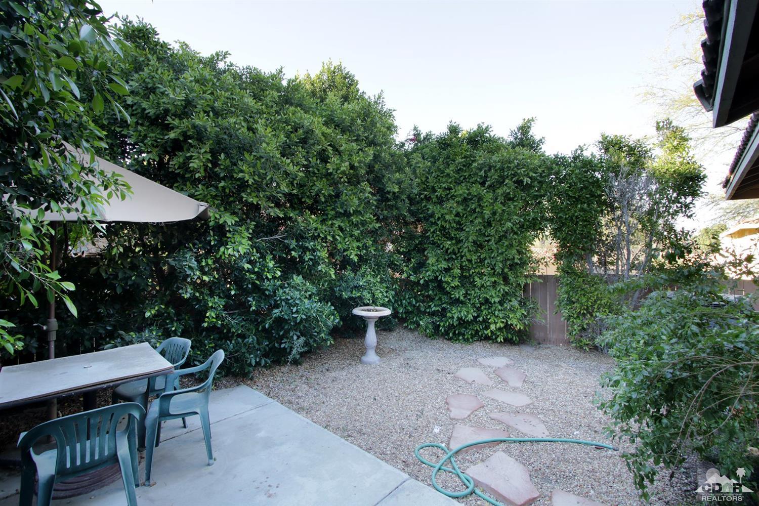43376 Cook Street, Unit 96 Palm Desert, CA 92211 - Photo 15 of 29 a view of backyard with plants and outdoor seating