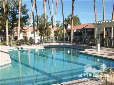 43376 Cook Street, Unit 96 Palm Desert, CA 92211 - Photo 17 of 29 a swimming pool with outdoor seating and yard