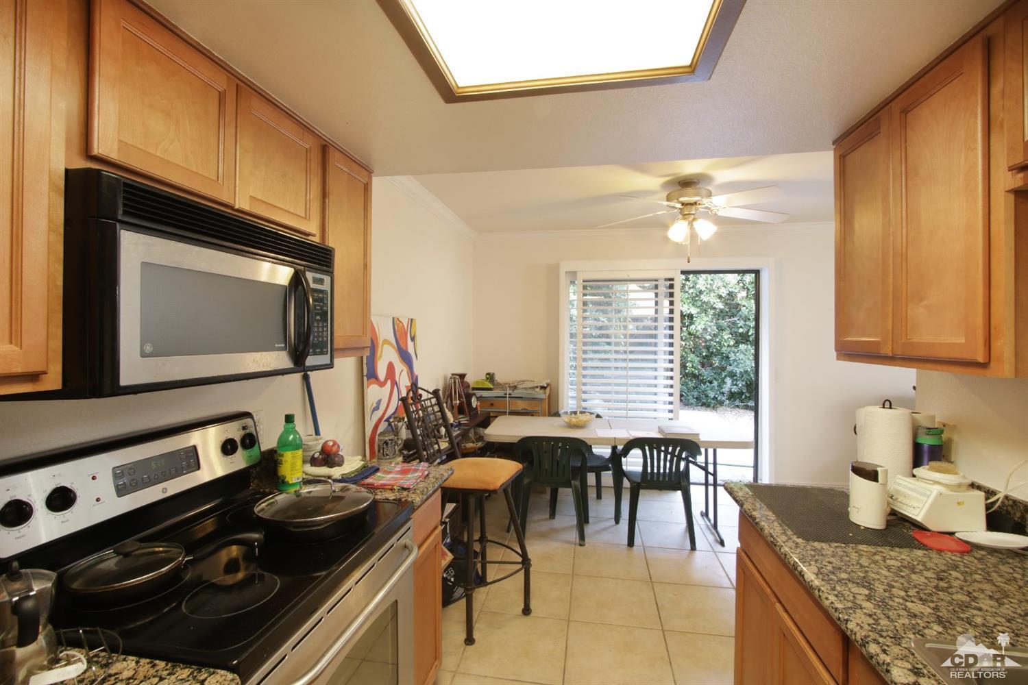 43376 Cook Street, Unit 96 Palm Desert, CA 92211 - Photo 2 of 29 a view of a dining room with furniture