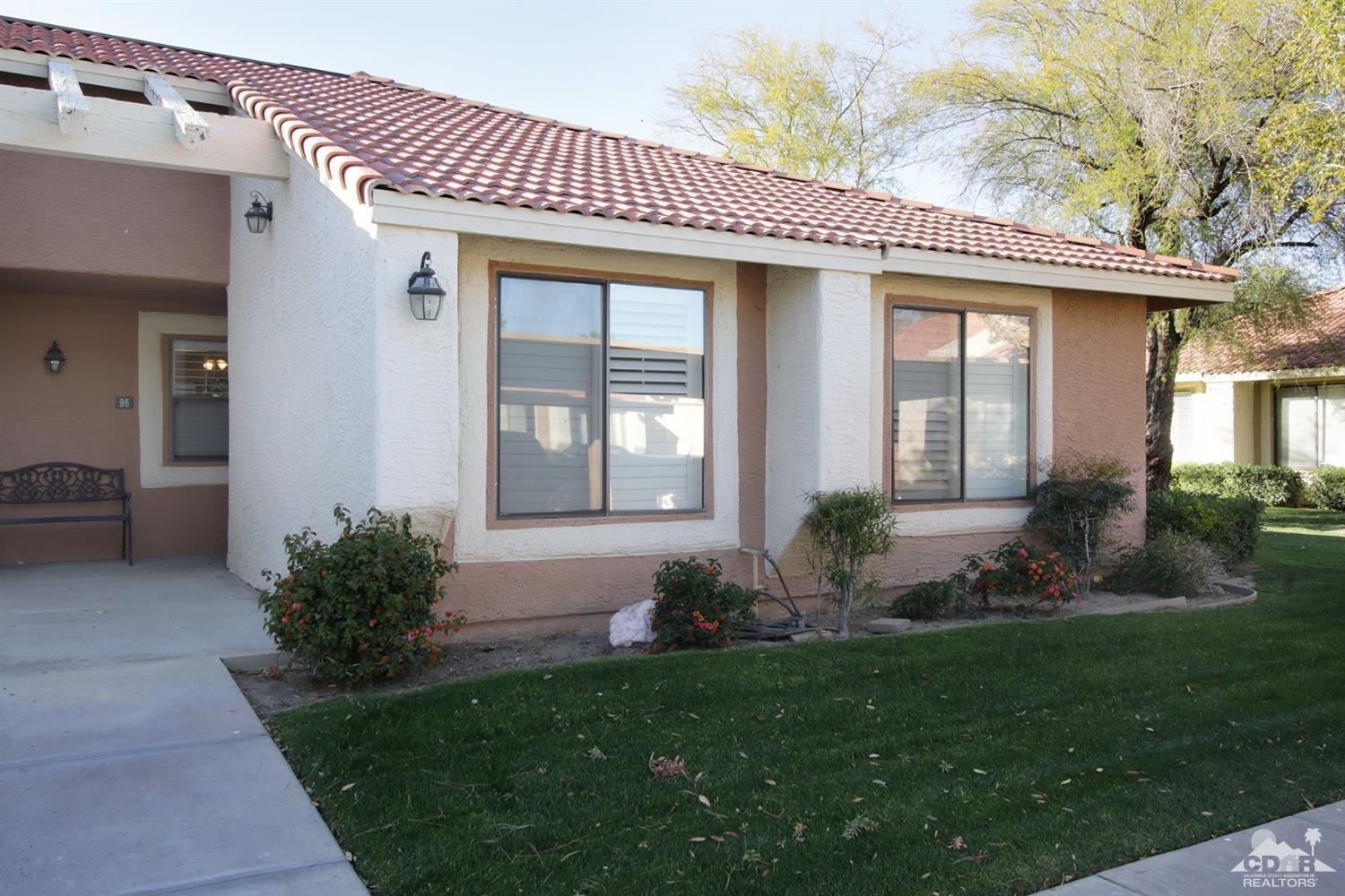 43376 Cook Street, Unit 96 Palm Desert, CA 92211 - Photo 27 of 29 a front view of a house with garden