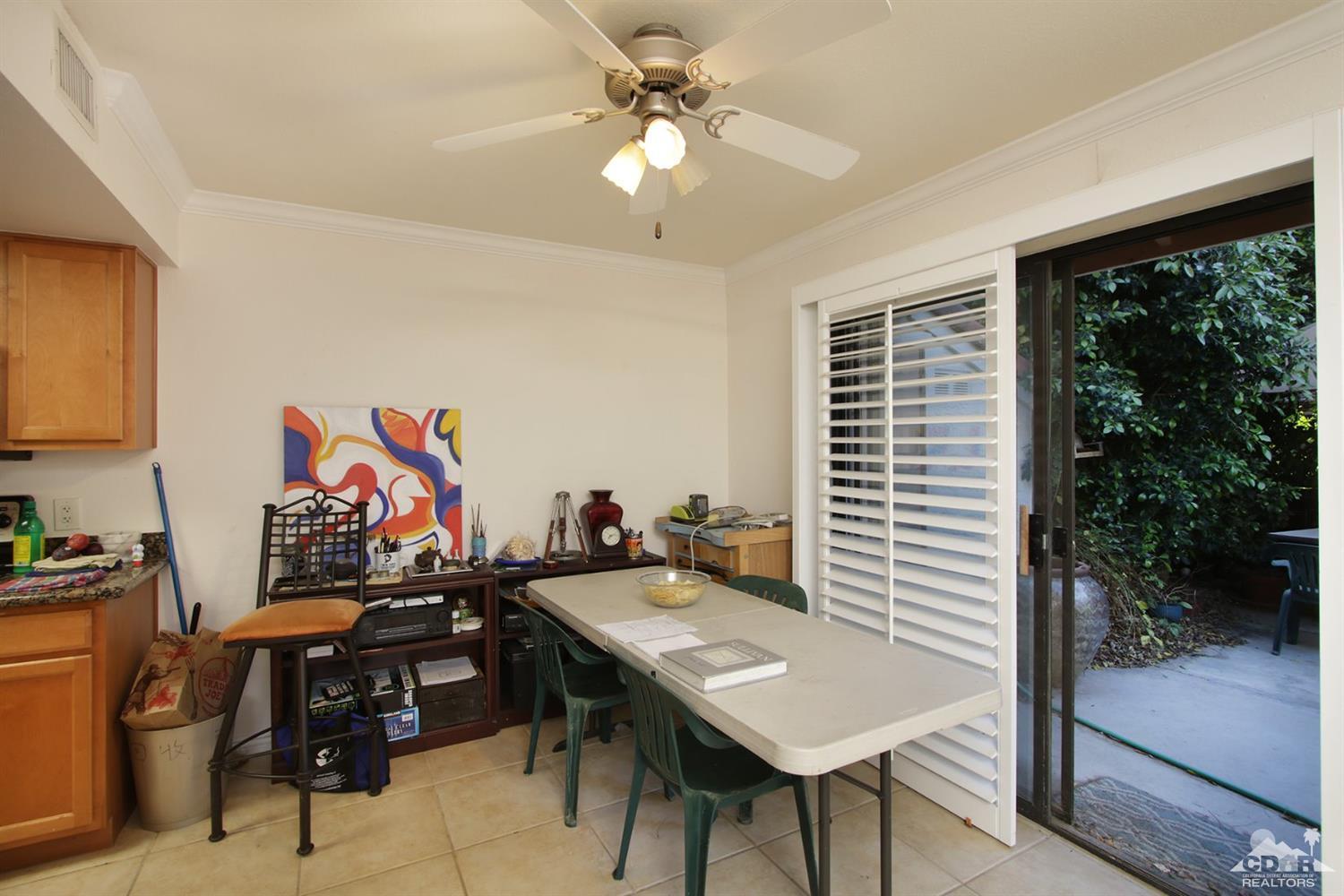 43376 Cook Street, Unit 96 Palm Desert, CA 92211 - Photo 4 of 29 a view of a workspace with furniture and a potted plant