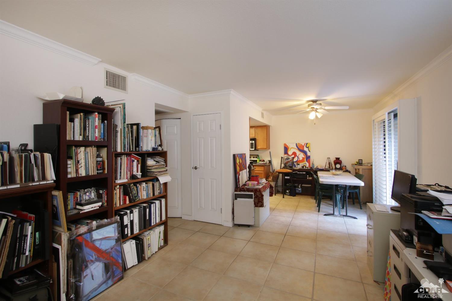 43376 Cook Street, Unit 96 Palm Desert, CA 92211 - Photo 5 of 29 a view of a livingroom with furniture and a bookshelf