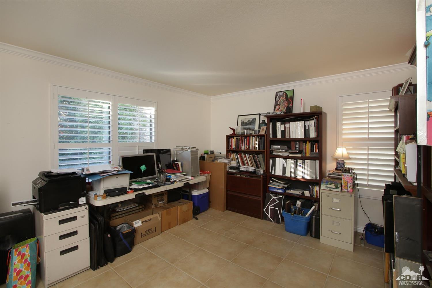 43376 Cook Street, Unit 96 Palm Desert, CA 92211 - Photo 7 of 29 a view of a workspace with furniture and a window