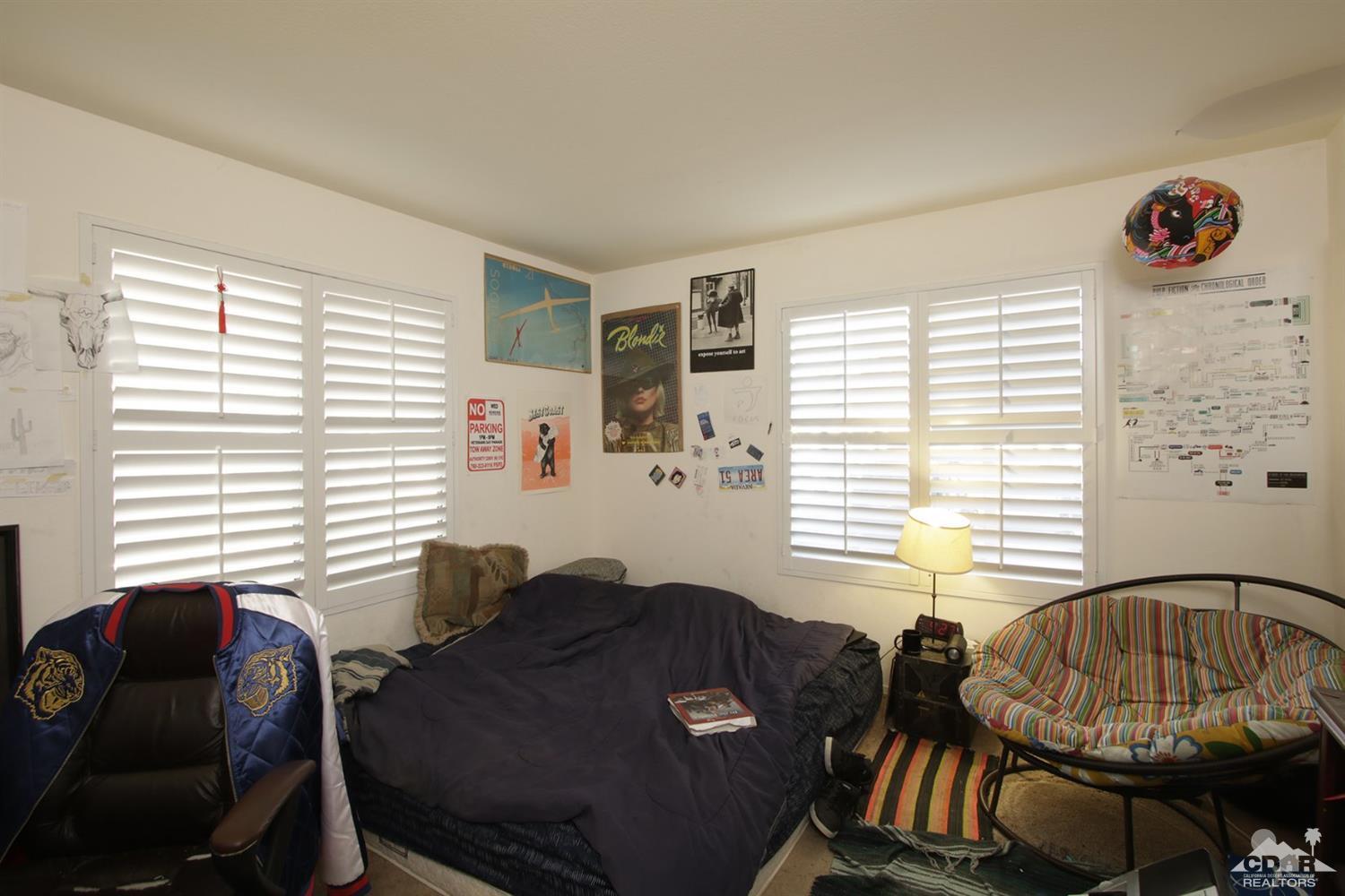 43376 Cook Street, Unit 96 Palm Desert, CA 92211 - Photo 10 of 29 a living room with furniture and a window