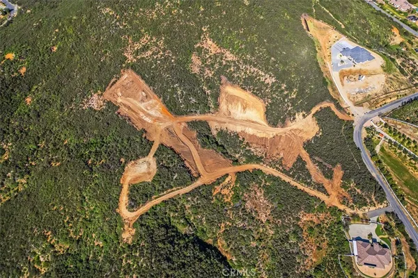 an aerial view of a house with swimming pool