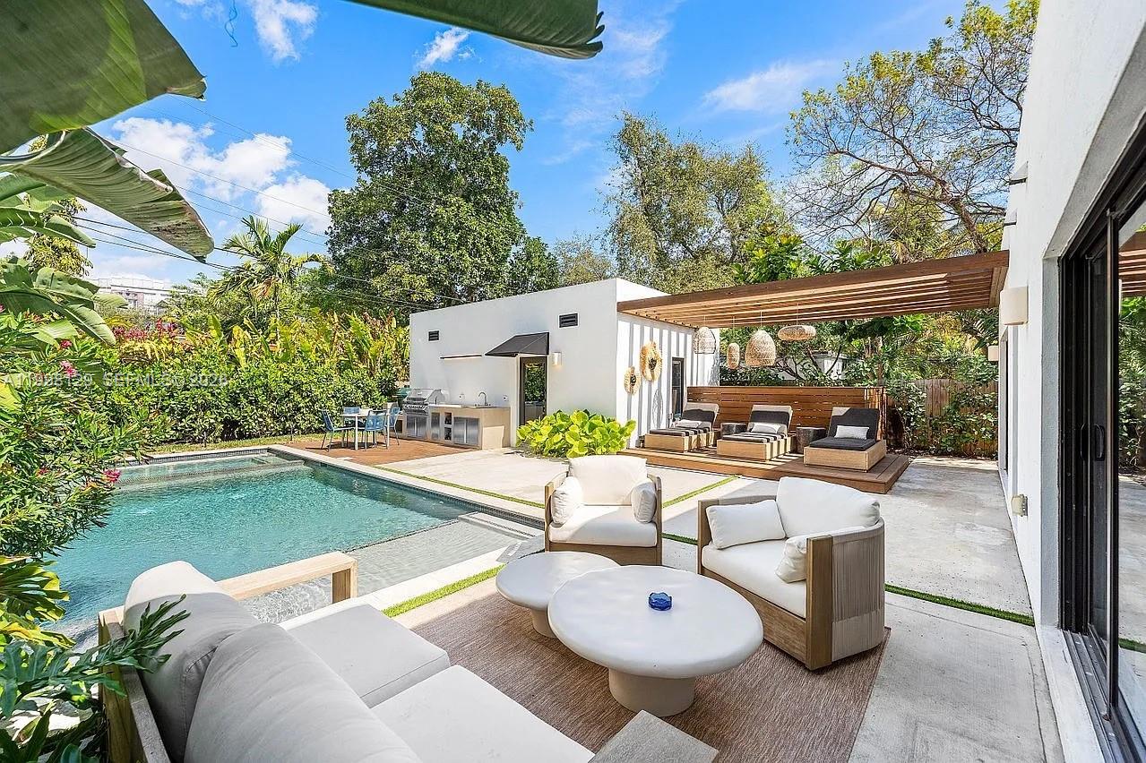 a view of a patio with swimming pool