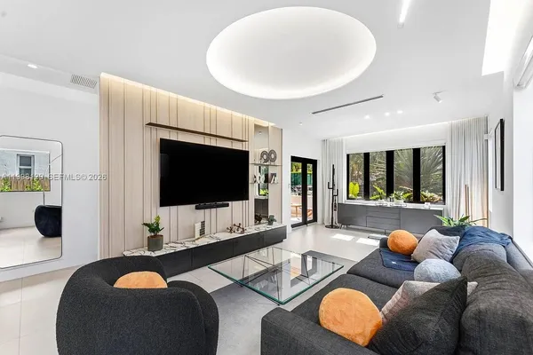 a bathroom with a sink a bathtub and a window