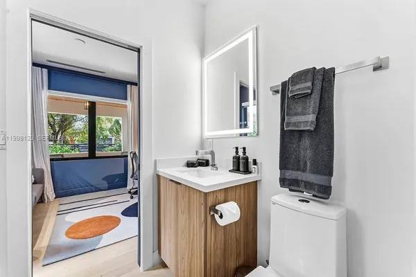 a bedroom with a bed and a bathroom