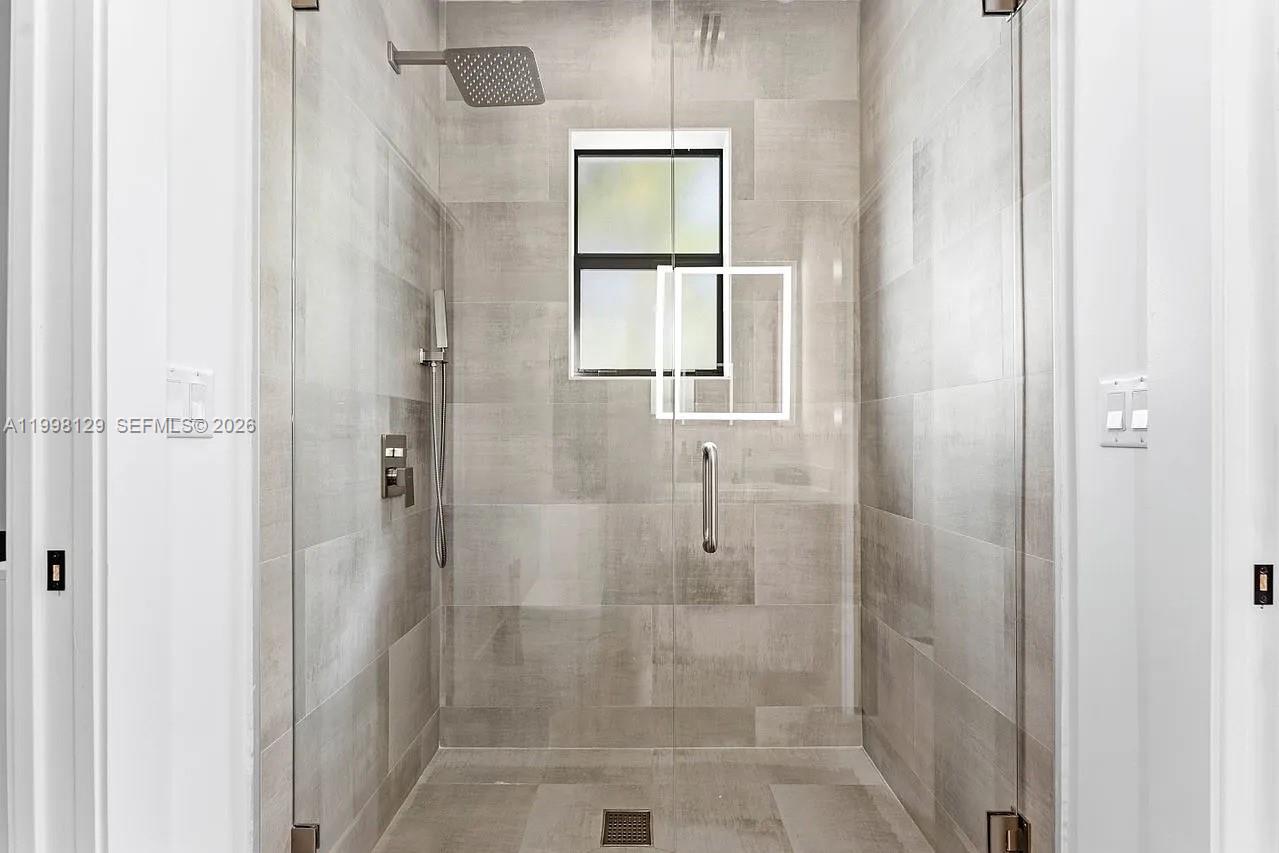 445 Northeast 76th Street Miami, FL 33138 - Photo 18 of 63 a bathroom with a shower