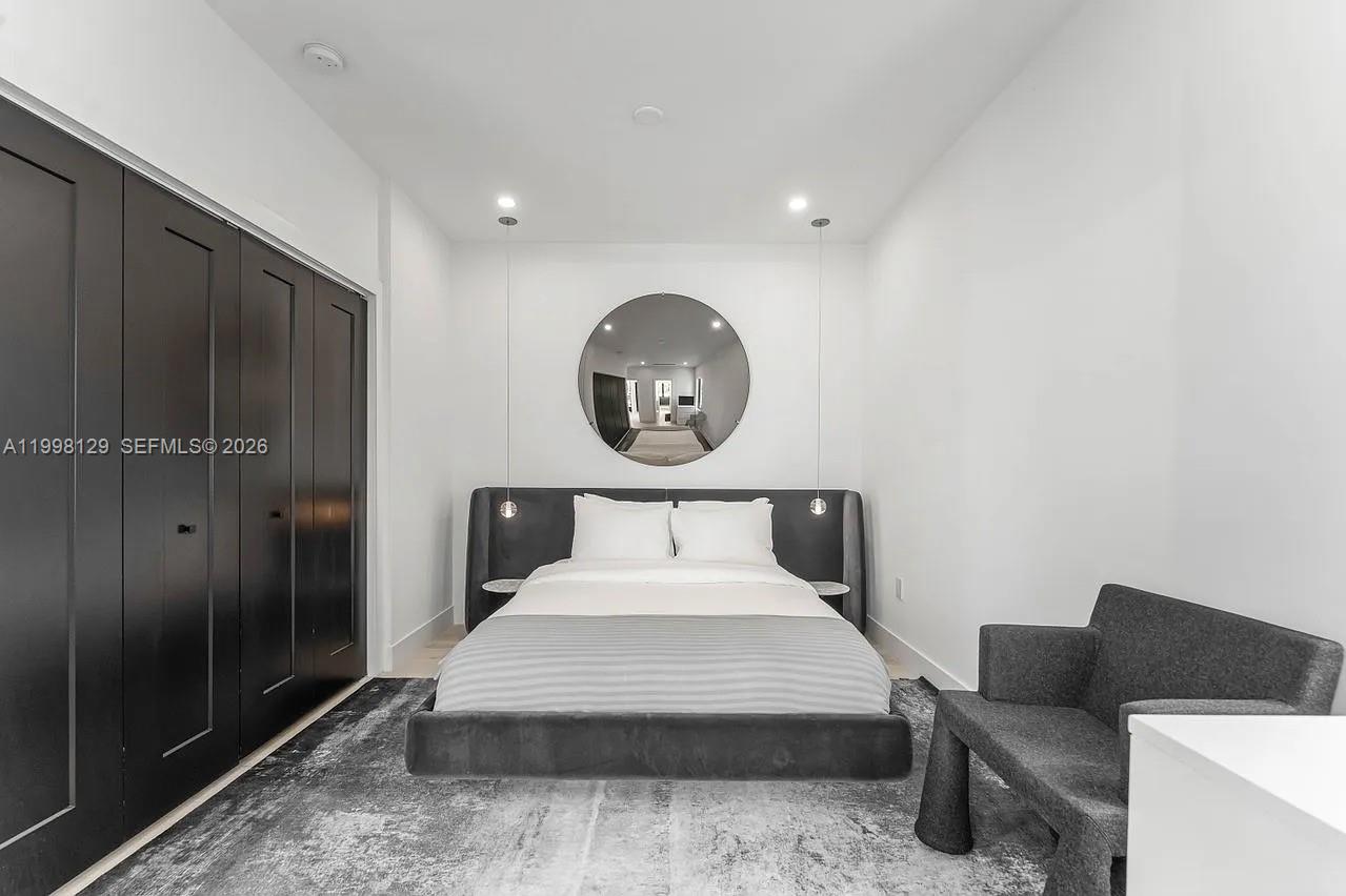 445 Northeast 76th Street Miami, FL 33138 - Photo 19 of 63 a bedroom with a bed and a bathroom
