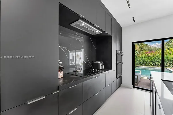 a bedroom with a large bed and a large window