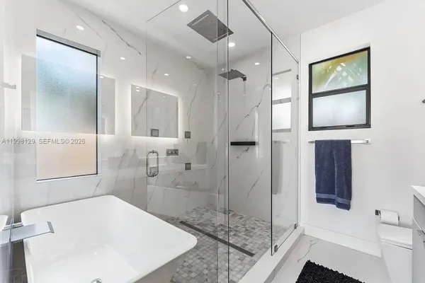 a view of a backyard with swimming pool