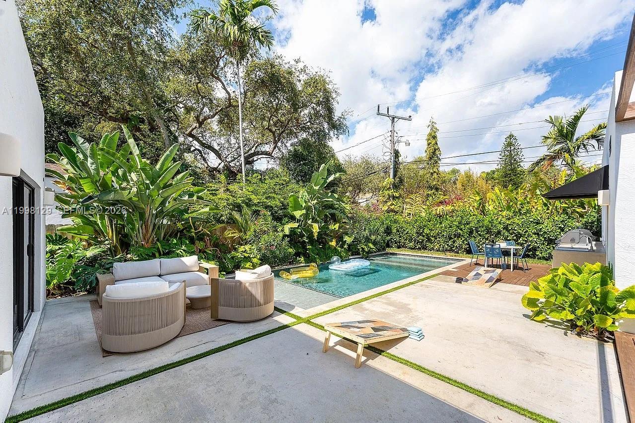 445 Northeast 76th Street Miami, FL 33138 - Photo 39 of 63 a view of a backyard with sitting area
