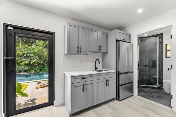 a house view with a backyard space