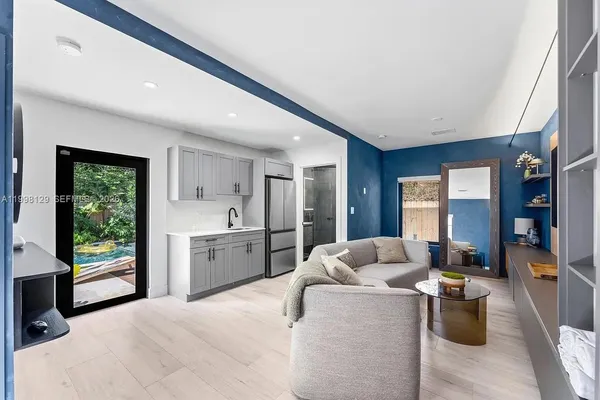 a view of swimming pool with sitting area