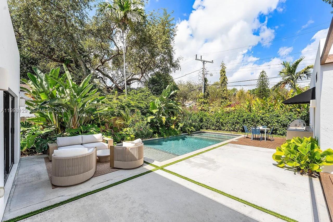 445 Northeast 76th Street Miami, FL 33138 - Photo 53 of 63 a view of a backyard with sitting area
