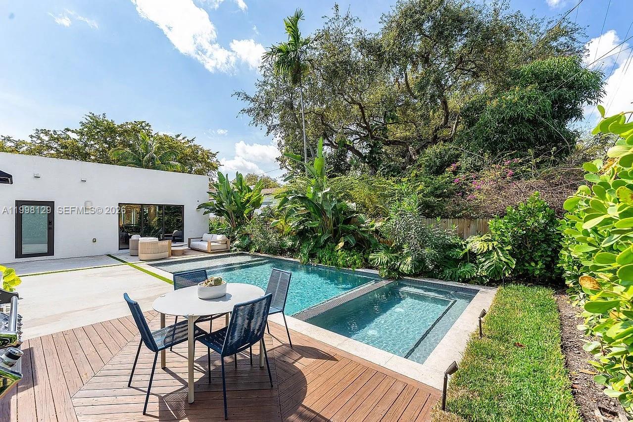 445 Northeast 76th Street Miami, FL 33138 - Photo 58 of 63 a view of house with swimming pool and sitting area