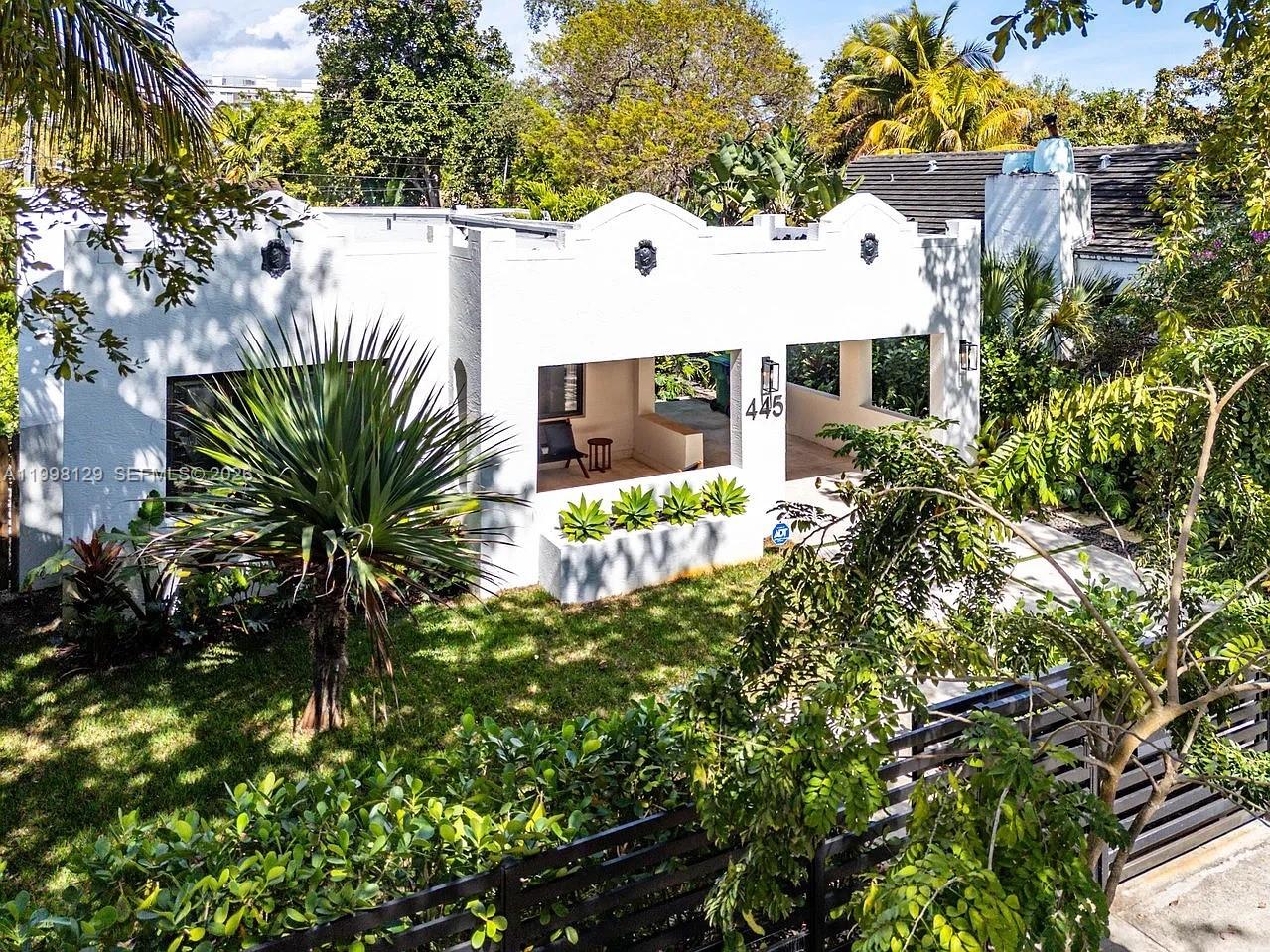 445 Northeast 76th Street Miami, FL 33138 - Photo 60 of 63 a view of a house with a yard and potted plants