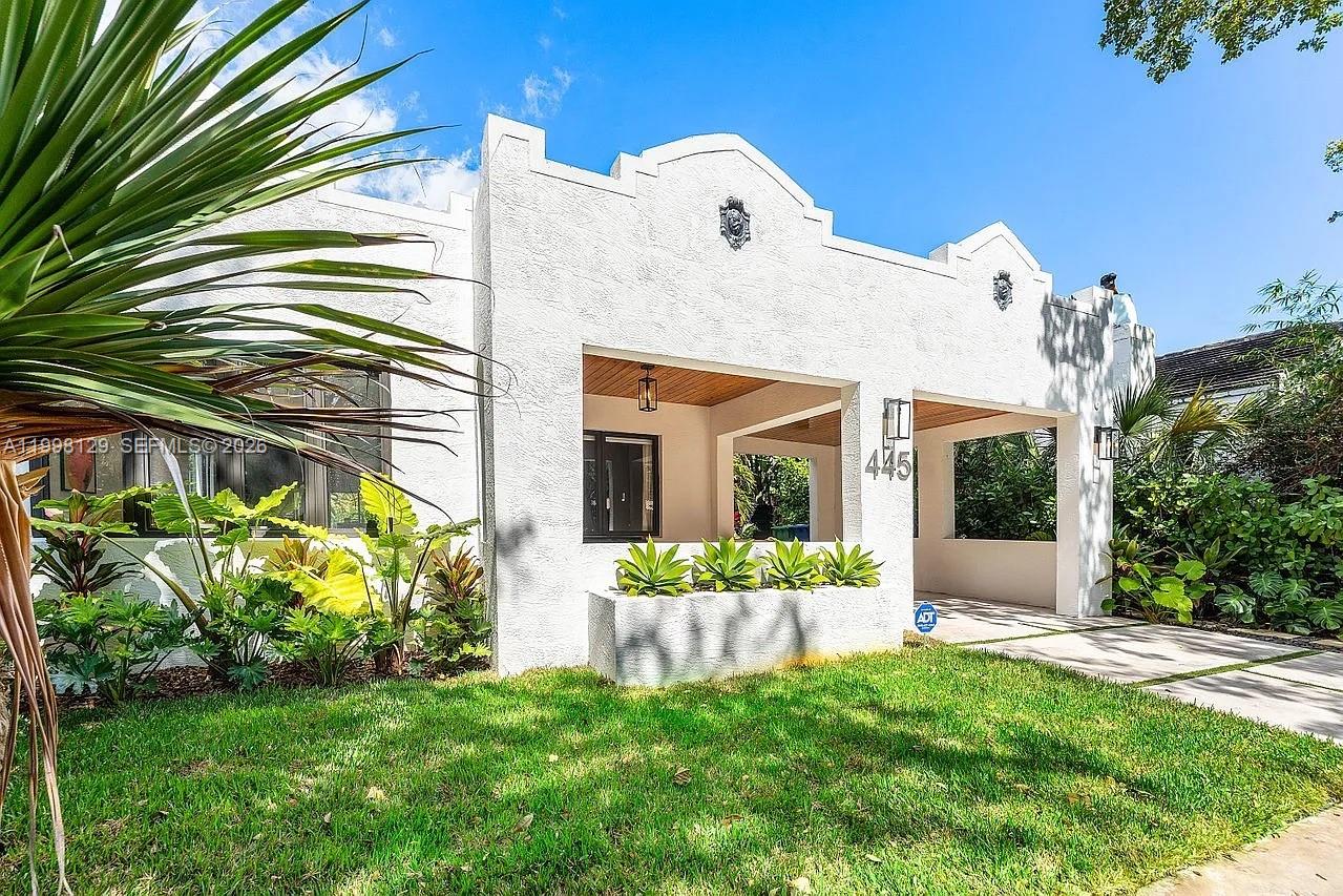 445 Northeast 76th Street Miami, FL 33138 - Photo 61 of 63 a front view of a house with garden