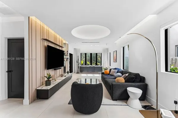 a living room with furniture and a window