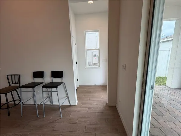a view of kitchen with furniture and wooden floor