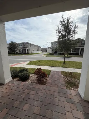 a view of a yard with an empty space