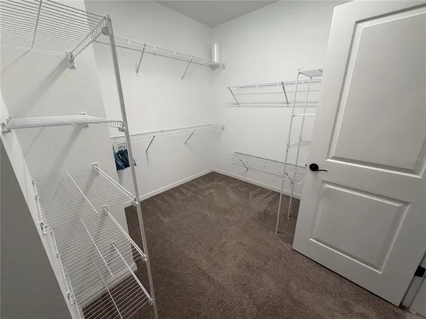 a view of a room with racks on the wall