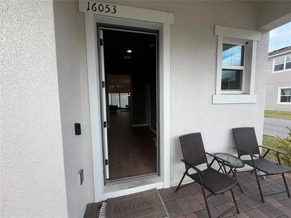 a view of a livingroom with furniture and windows